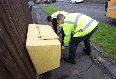 Grit team filling grit bin