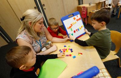 Early years staff teaching pupils