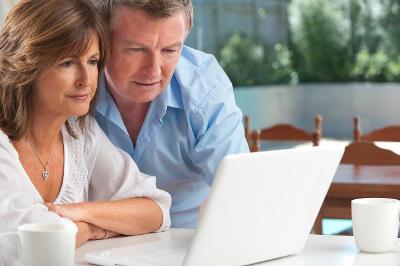 Couple using laptop